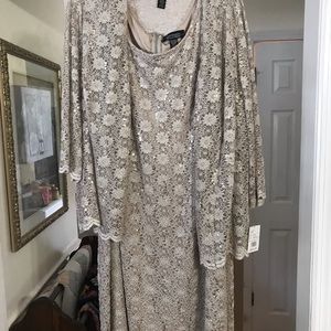 Dress by R and M Richards. Was purchased to attend a wedding but was never worn.